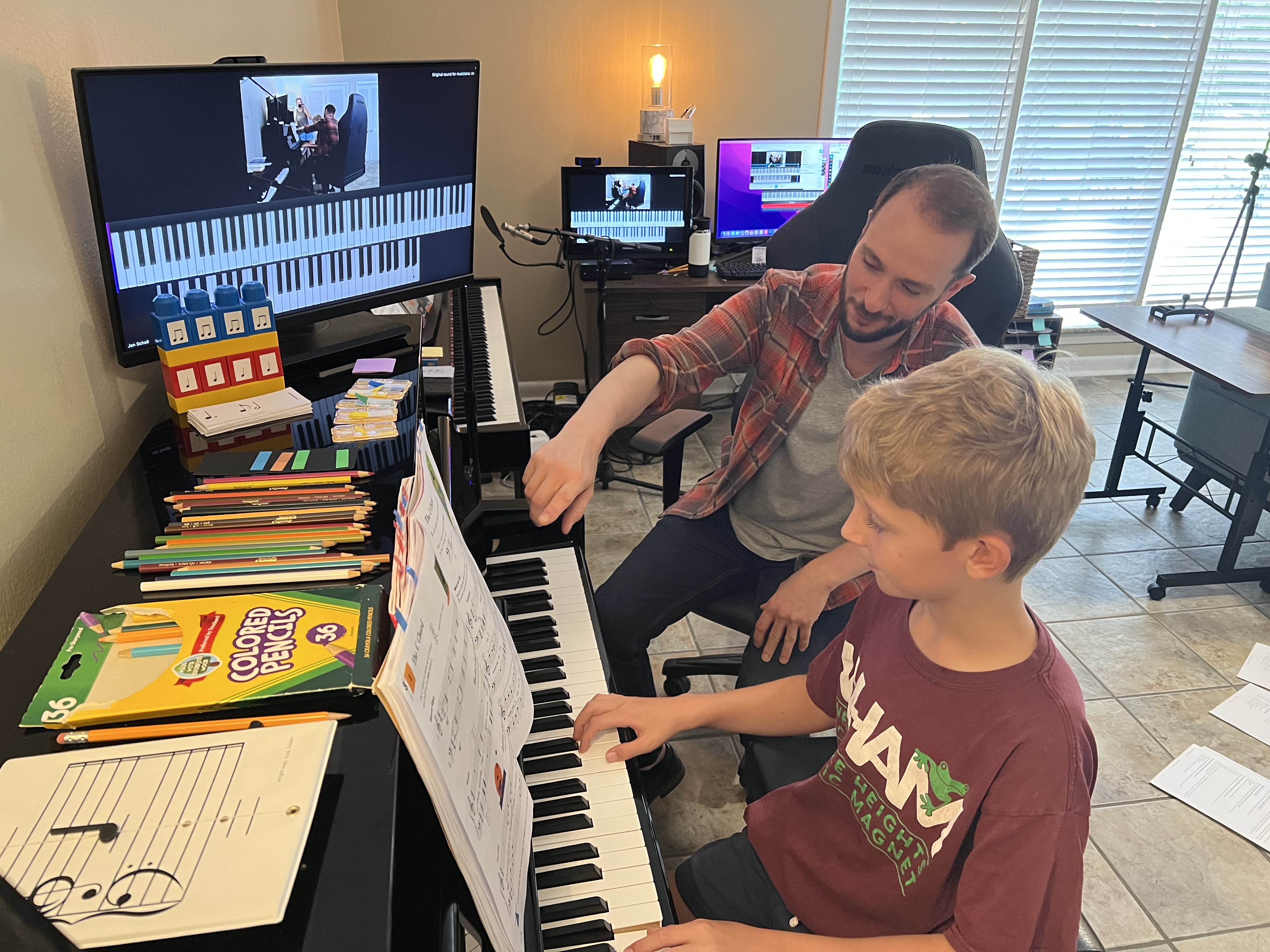 Student learning at the piano