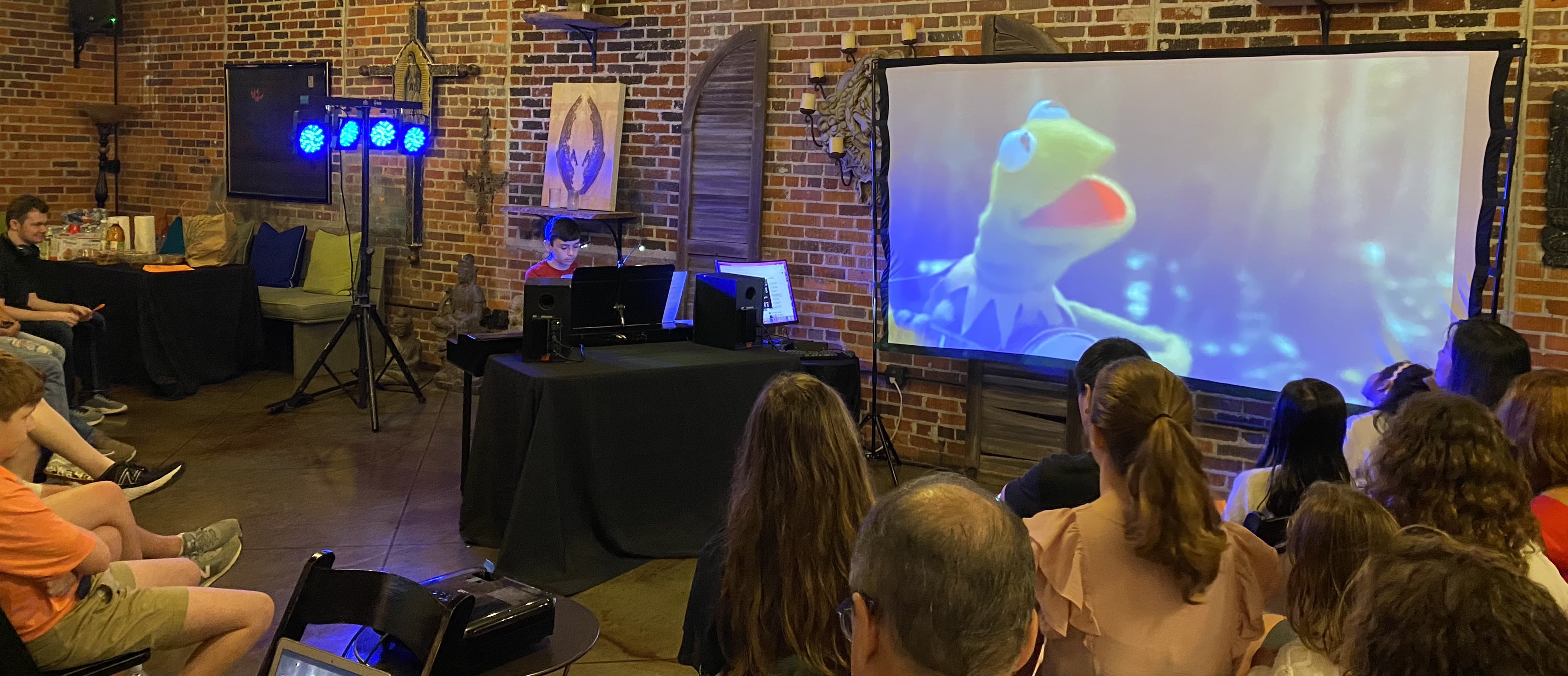 Student performing Kermit's song at the Movie Music Concert