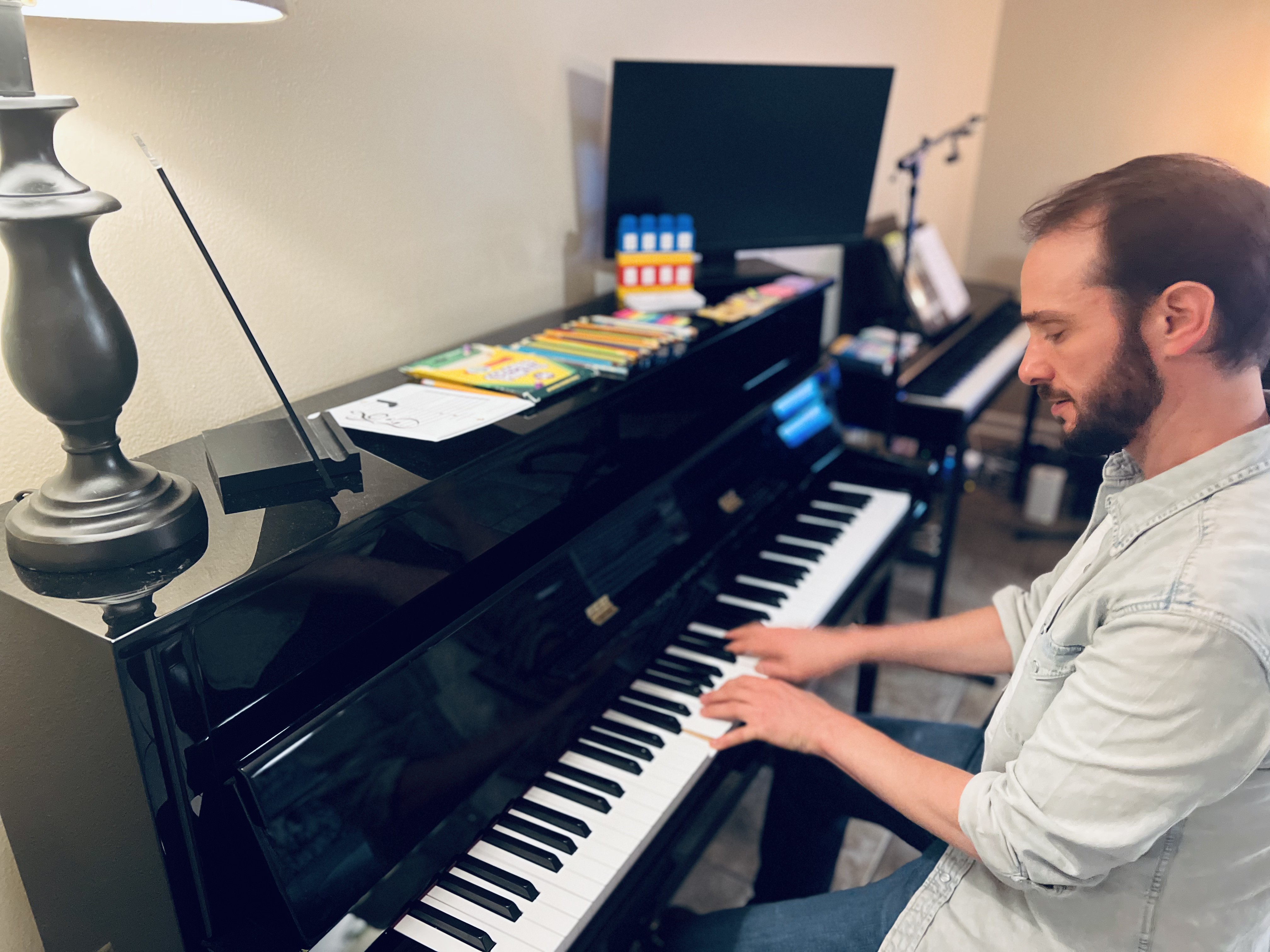 Jon playing piano in the studio