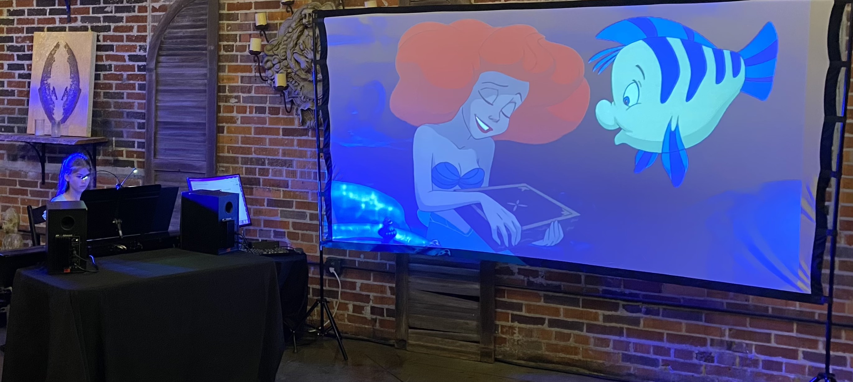 Student performing The Little Mermaid at the Movie Music Concert
